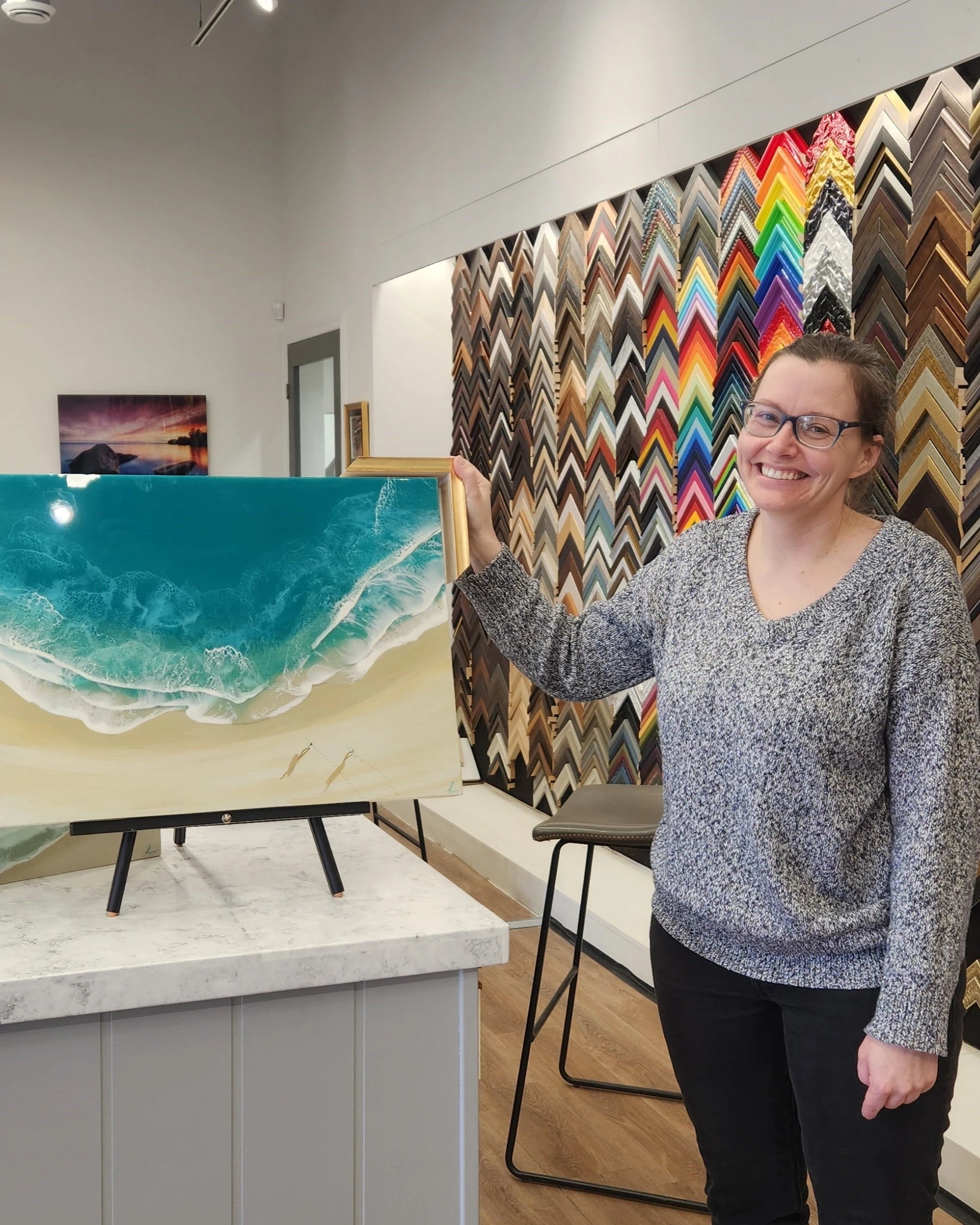 Kingston Frameworks team celebrating 40+ years of custom framing excellence