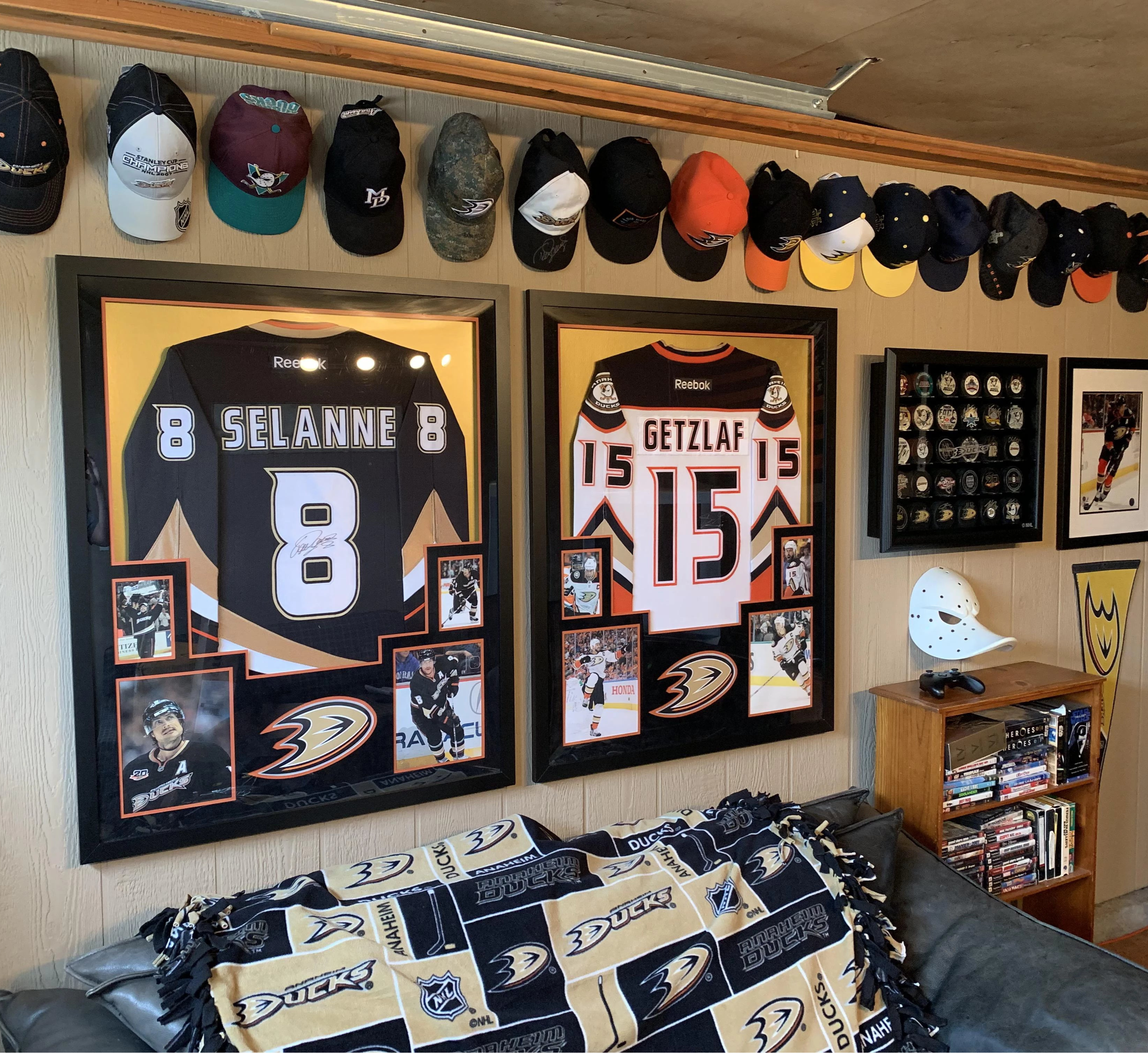 Signed hockey jersey in black shadowbox frame on basement wall