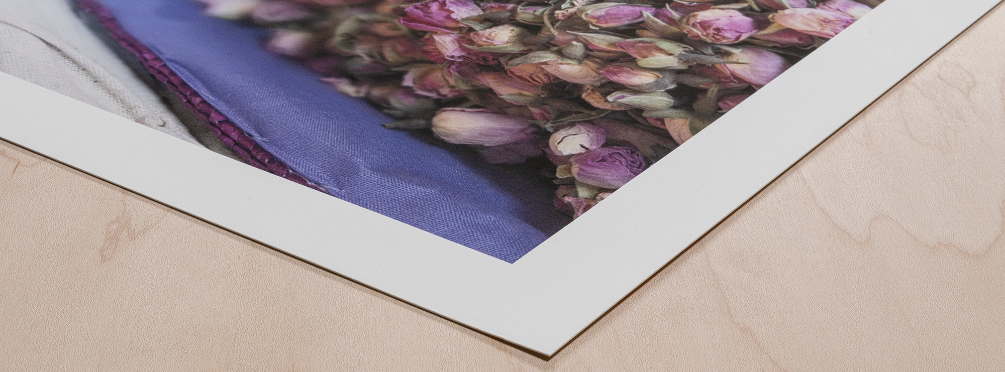 Custom frames for giclée prints and watercolor art hanging in an elegant gallery.